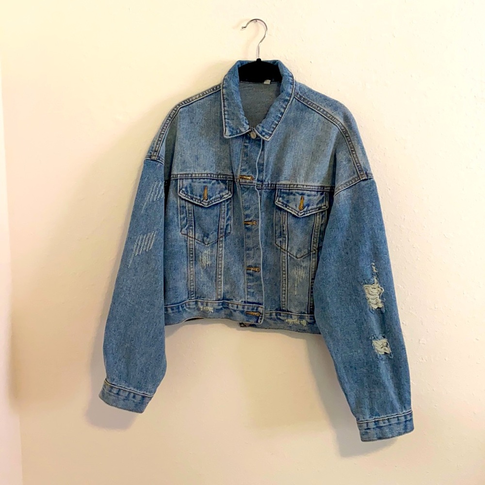 Distressed blue jean jacket